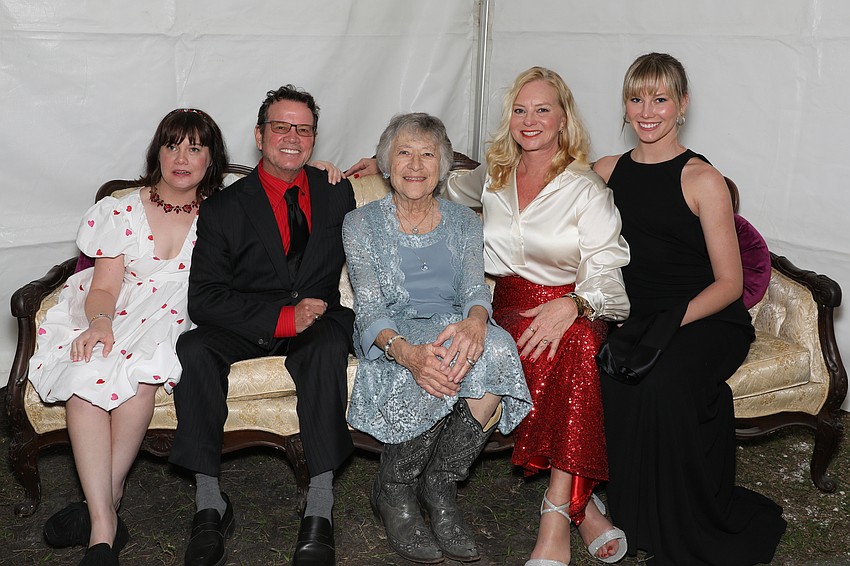 Scarlett, Chris, Brenda, and Isabella Whaley pose on this vintage couch with Phyliss Siskel, center