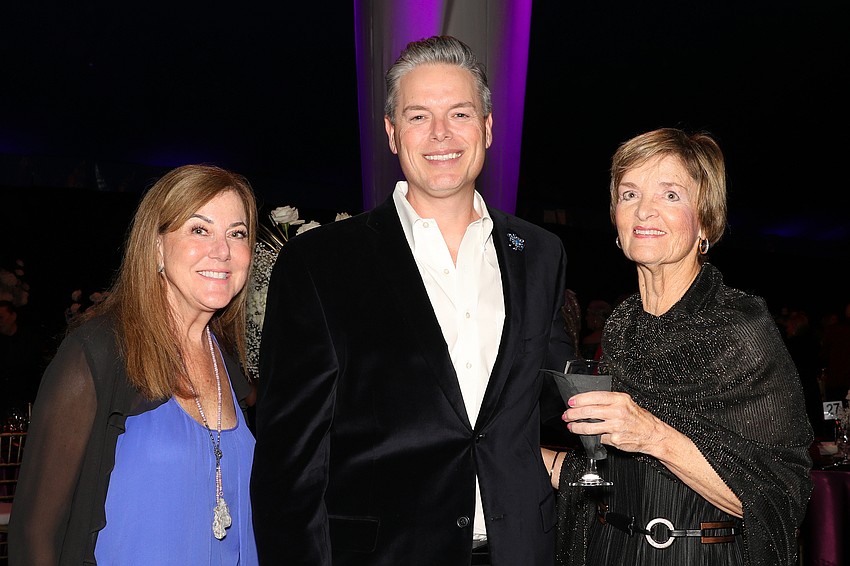 Cindy McCollum and Carol Beeler with Phillip Lanham