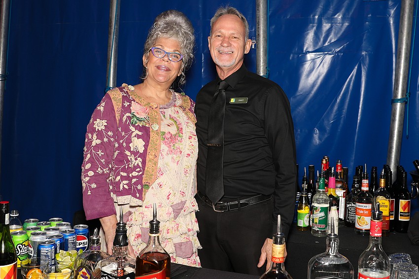 The always radiant catering queen Tracey McCammack of Michael's on East, and Jimmy Shawver who has been with MOE for over 28 years.