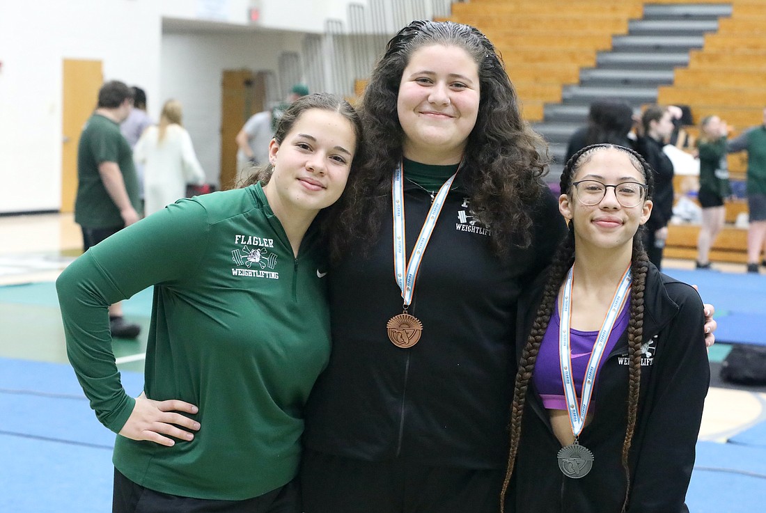 FPC's Chloe Long, Zoey Gotera and Nya Williams qualified for both the Olympic and traditional competitions in the Class 3A state girls weightlifting championships. Photo by Brent Woronoff
