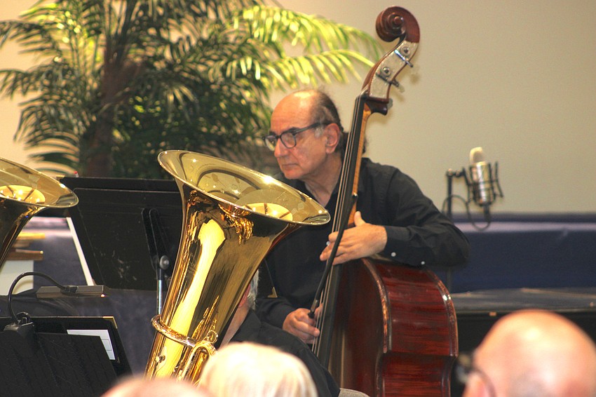 Joe Bruno, Jr., lends support to the wind instruments by playing the string bass.