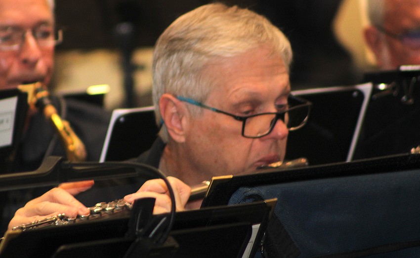 Tom Bancroft plays the flute during the 