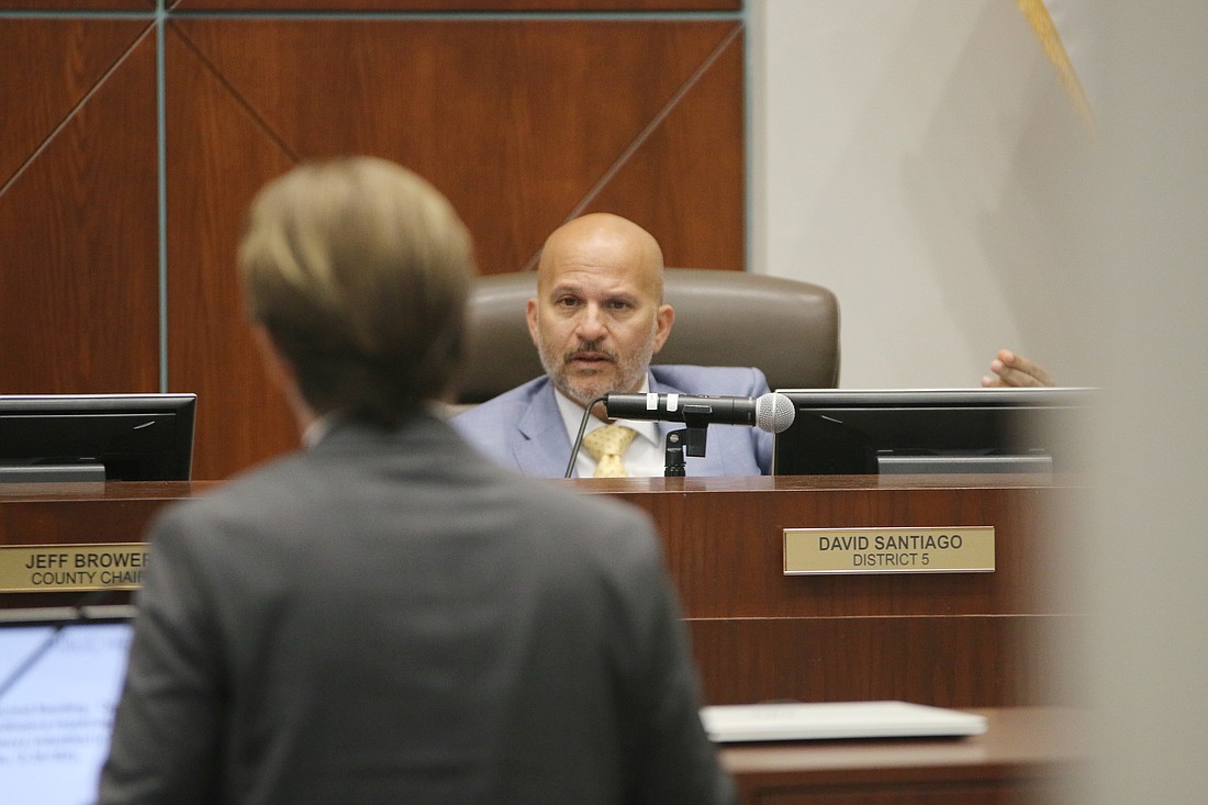 Volusia County Councilman David Santiago asks GrayRobinson attorney Nick Dancaescu a question during the Feb. 6 meeting. Photo by Jarleene Almenas