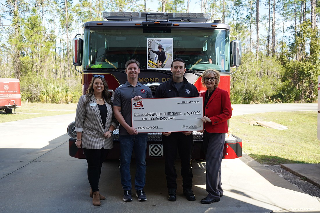 Karisa Newman, of LPT Realty; Ormond Beach Fire Capt. David Randall; firefighter Nick Nates; and Capt. Carrie Davis. Photo courtesy of the city of Ormond Beach