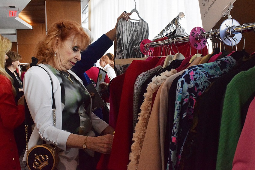University Park's Sharon Garden peruses the clothing available from the Women Resource Center's Unique Boutique.