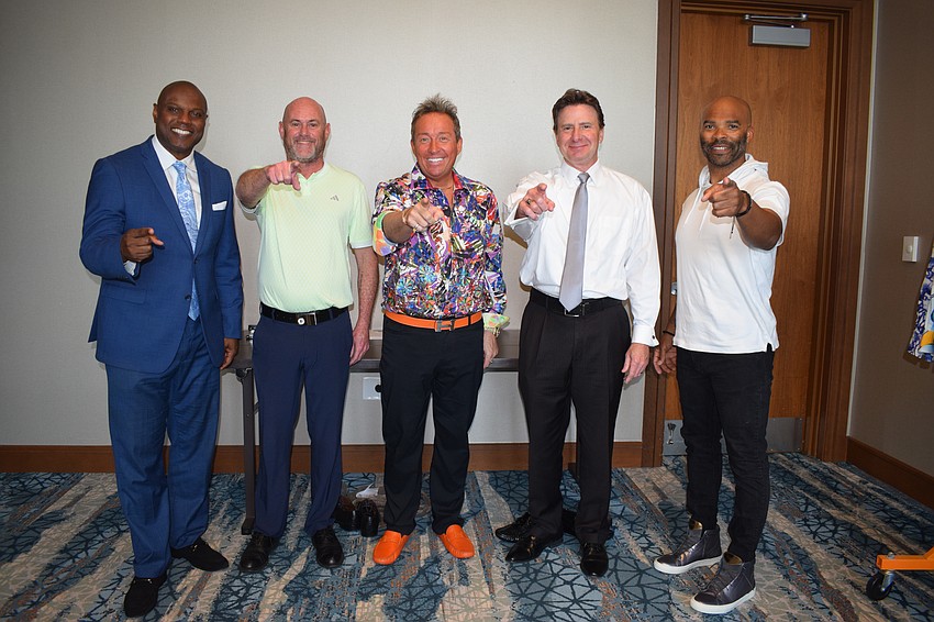 Emcee Norris Thomas joins models Ashley Hayden, Tyler Butler, Bart Schubert and Rodrick Miller before the event.