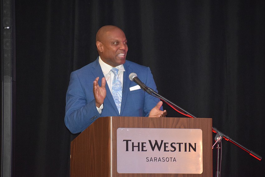 Norris Thomas, a former professional athlete and professional speaker, serves as emcee at the University Park Women's Club Fashion Show.