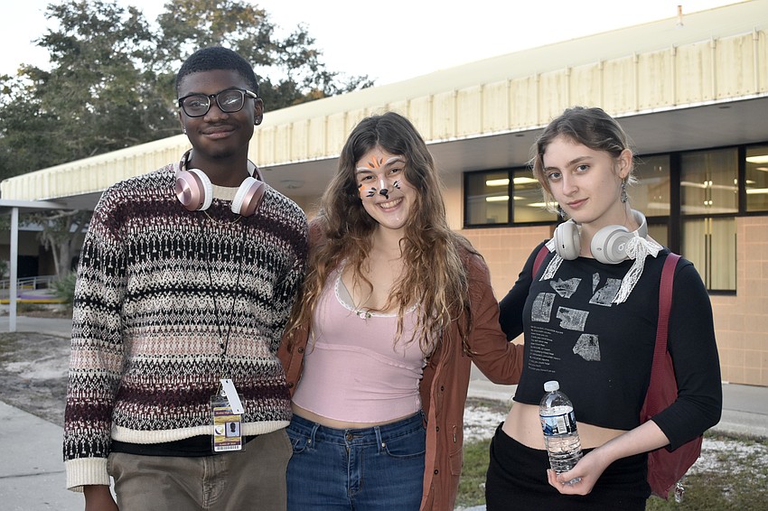 Booker High School seniors Mekhi Jones, Chloe Johnson and Aurora Newcomb