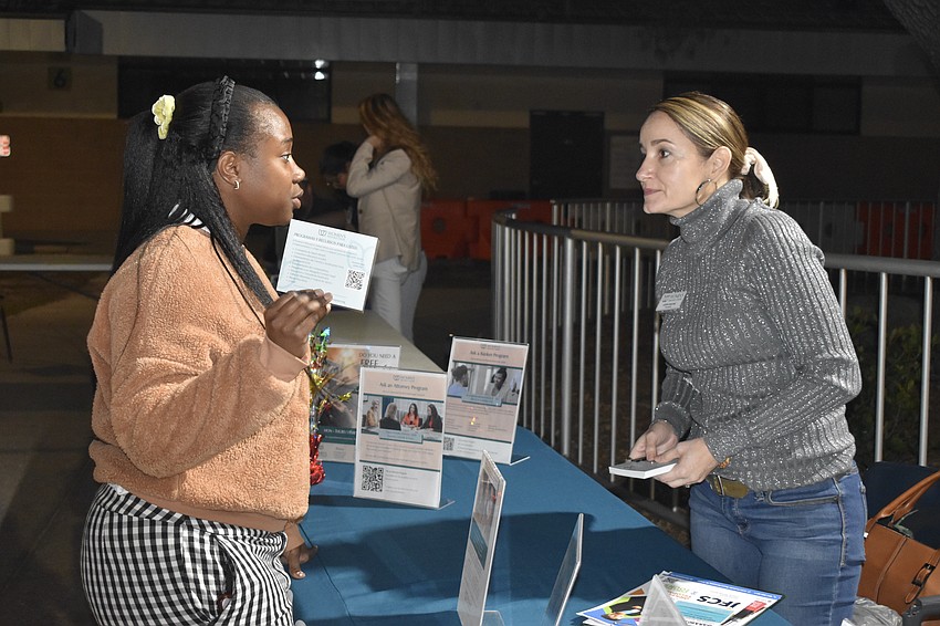 Michal Bennett of MCR Health speaks with Judith Sanchez of Women's Resource Center.