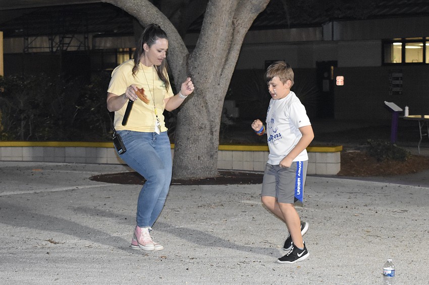 Lauren Piatt dances with her son, Dax Piatt, 9.