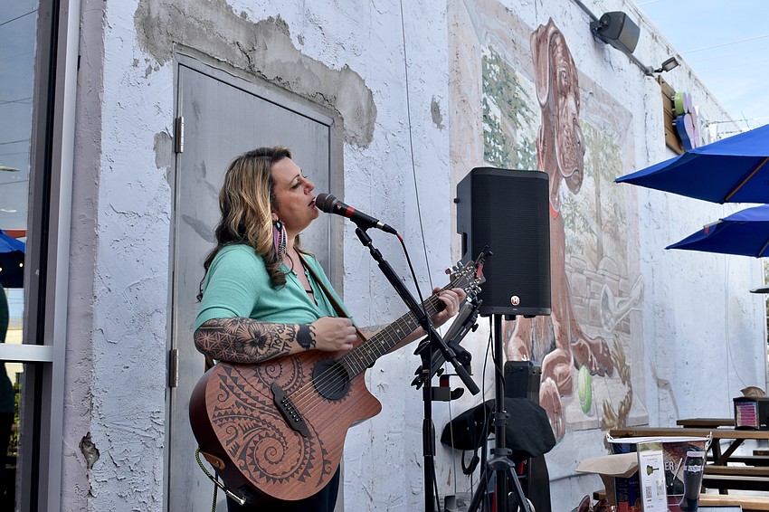 Julia Brown sings in the outdoor area.