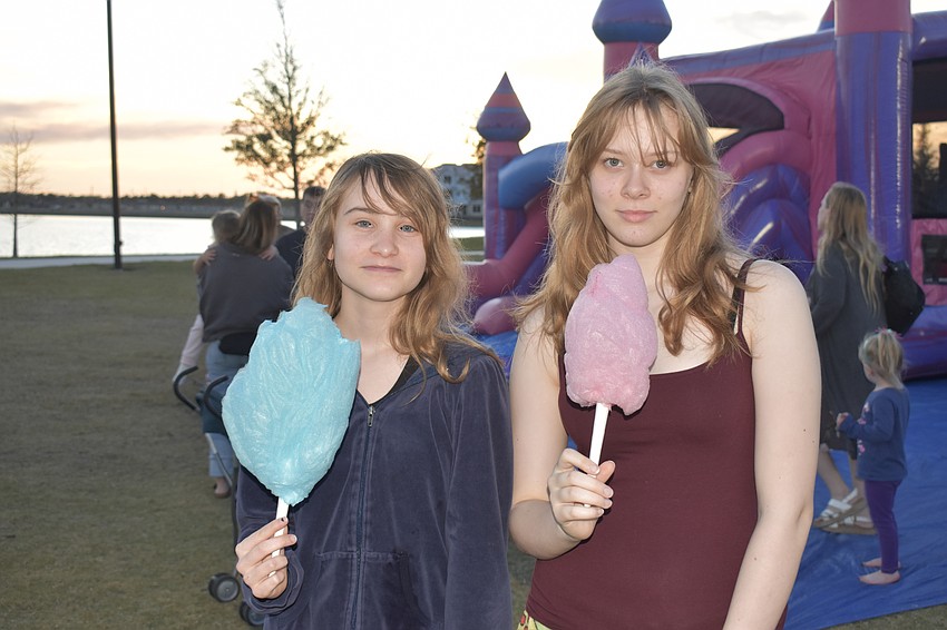 Lakewood Ranch residents Elizabeth Condon and Emma Johnson stroll the park with their cotton candy.