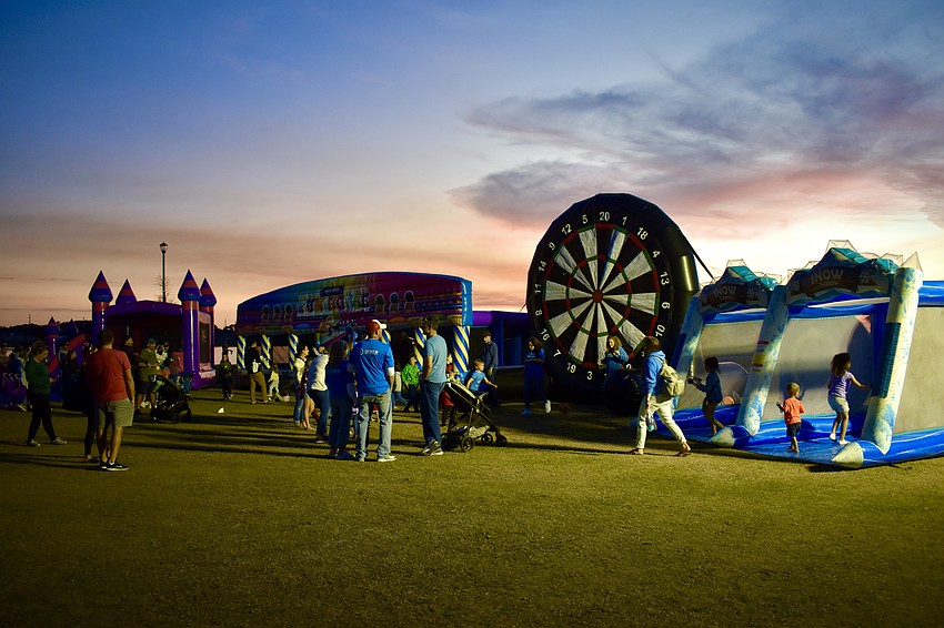 A row of inflatables keeps the crowd busy before the movie starts.