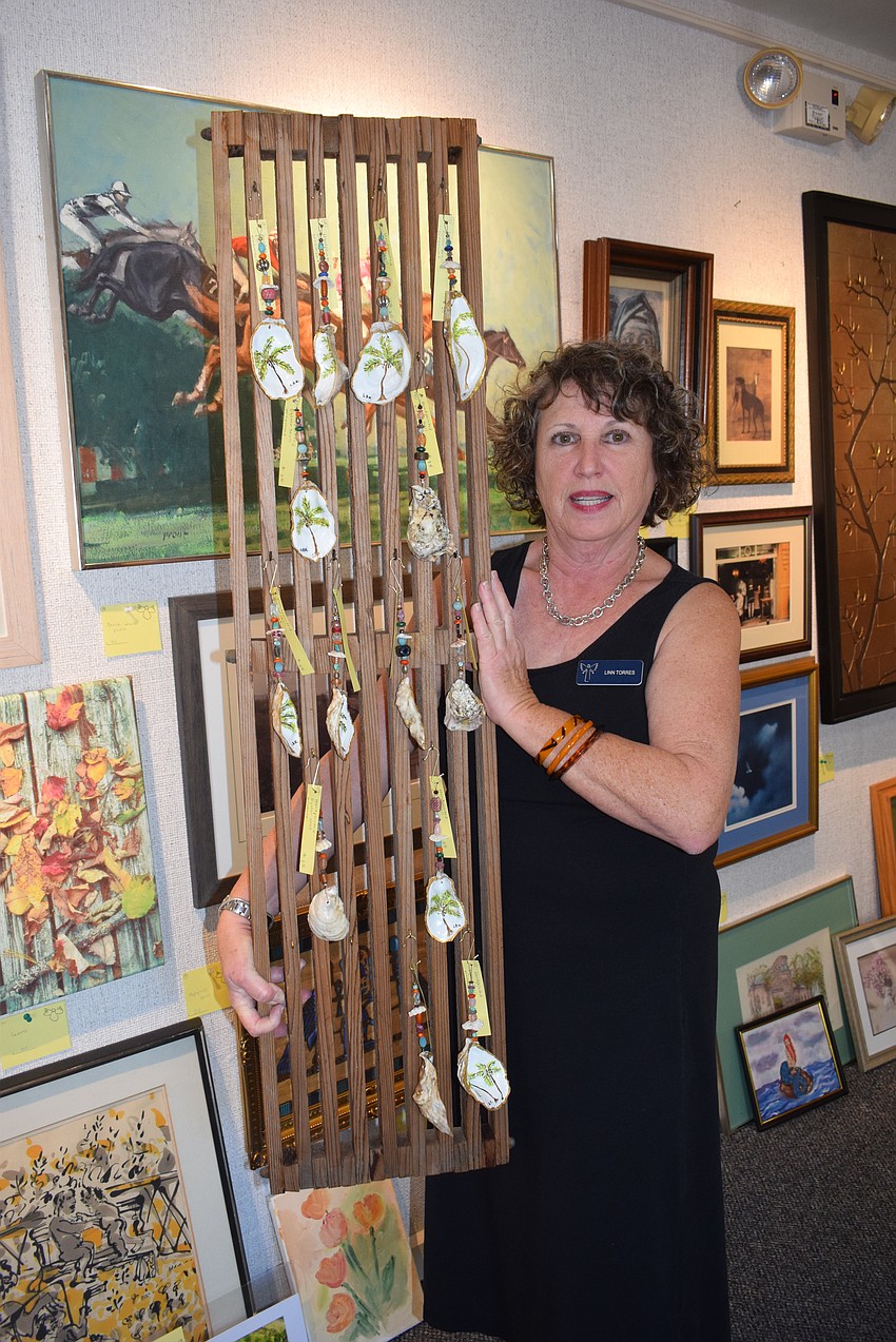 Linn Torres with her art at the 