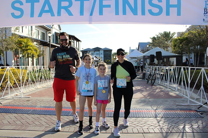 Butch, Emmersyn, Sawyer and Lindsay Ogden can't wait until the start of the Run for the Beads at Waterside Place.