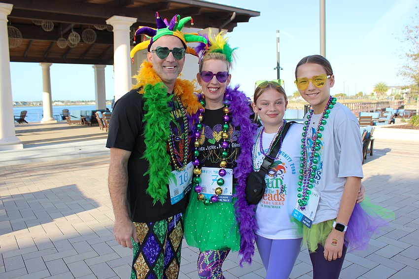 Besides the 5K race/walk, Run for the Beads also included a costume contest and Jason Miller, Amy Lowrance, Sophie Lowrance, and Haley Hartman looked perfect for the Mardi Gras theme.