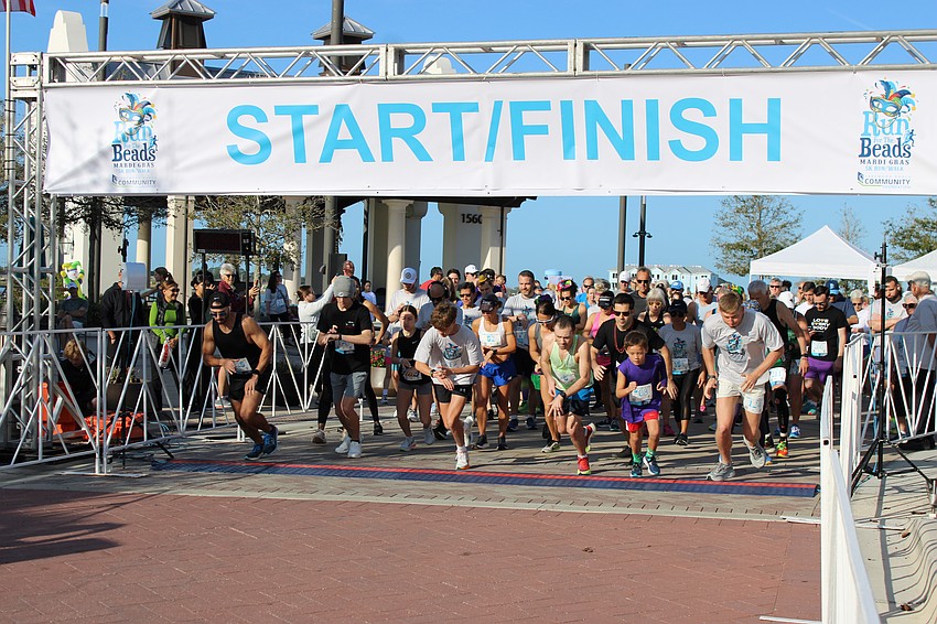 Runners burst out of the gate for the start of the second annual Run for the Beads, presented by the Lakewood Ranch Community Foundation.