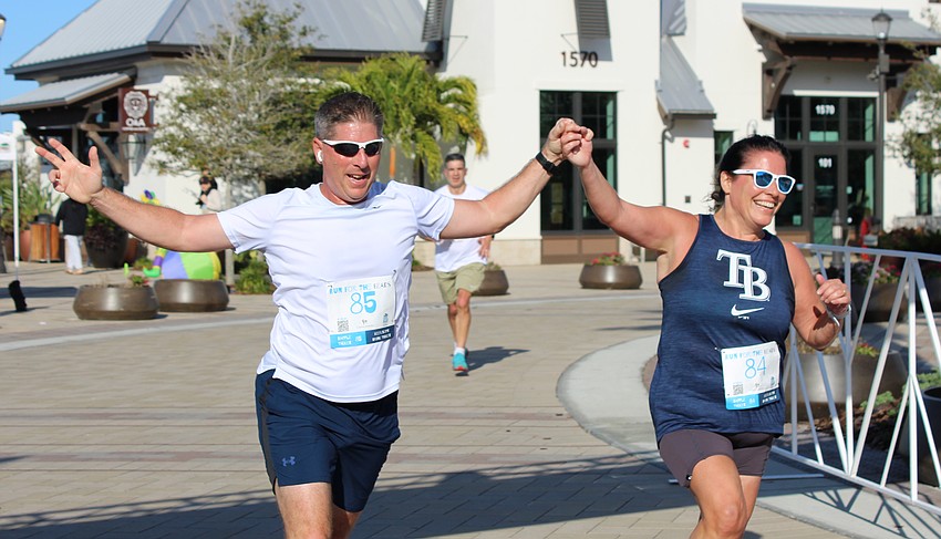 Lakewood Ranch's Steve and Laura Saladino finish the Run for the Beads together. Steve says Laura, who married him 31 years ago, 