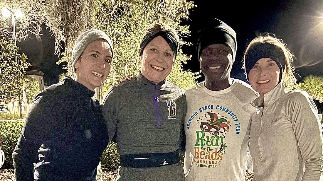 Lakewood Ranch Running Club's Lorena Barona, Monika Oberer, Woodford Joseph and Alexis Dwyer pose after a run. Oberer credits her club members for helping motivate her and train for the Tokyo marathon in March.