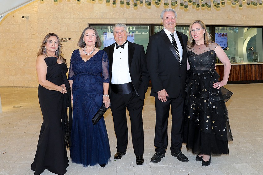 Orchid Ball guests Rachel Durrani and Zelia and Martin Trueb are greeted by Rob Rominiecki and Selby Gardens CEO  and Jennifer Rominiecki.