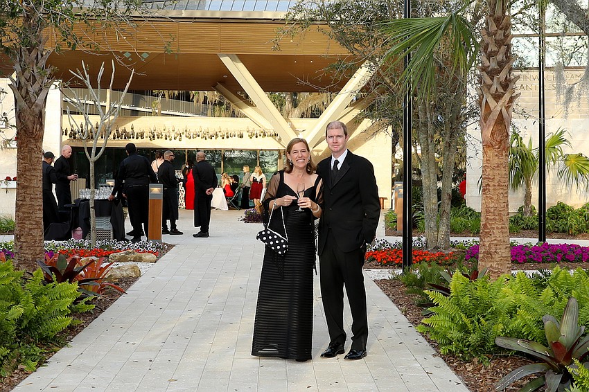 Sandra and Dan O'Neill make a champagne entrance into the redesigned Marie Selby Botanical Gardens.