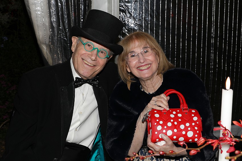 Richard Sandor's top hat was a hit, and wife Ellen enjoys her polka dot handbag.