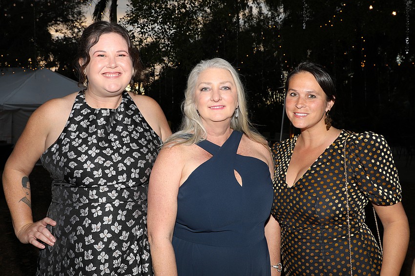 Caitlin Whiteaker, Julie Burton and Ashley Jimenez enjoy cocktail hour.