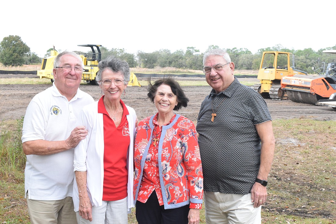 Christopher and Emmy Treston and Janice and Michael Novello look forward to the new parish activity center and rectory.