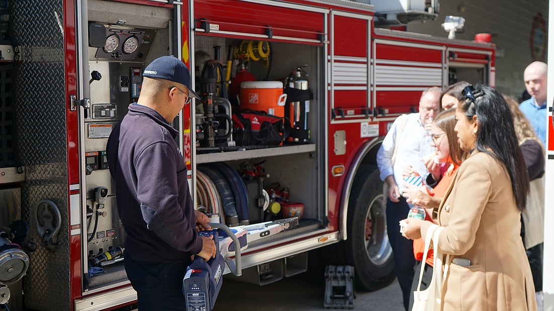 Firefighter Paramedic Tirso Guerrero shows guests the new Hurst Jaws of Life.