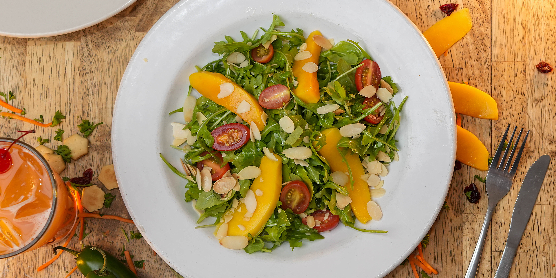 The Rocket salad at Lucky Pelican is adorned with mango slices.