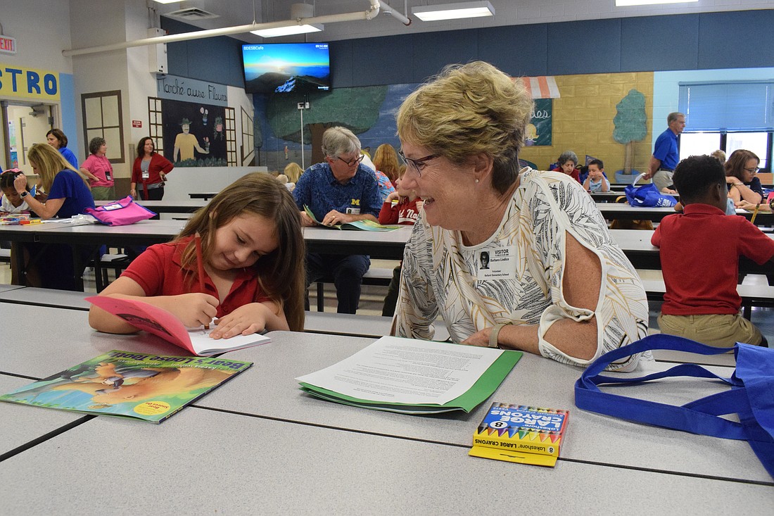 Kambrie Rowell, a Ballard Elementary kindergartner in 2022, loves working with her literacy mentor, Esplanade's Barbara Liodice, who volunteers for the Books for Kids Kindergarten program.