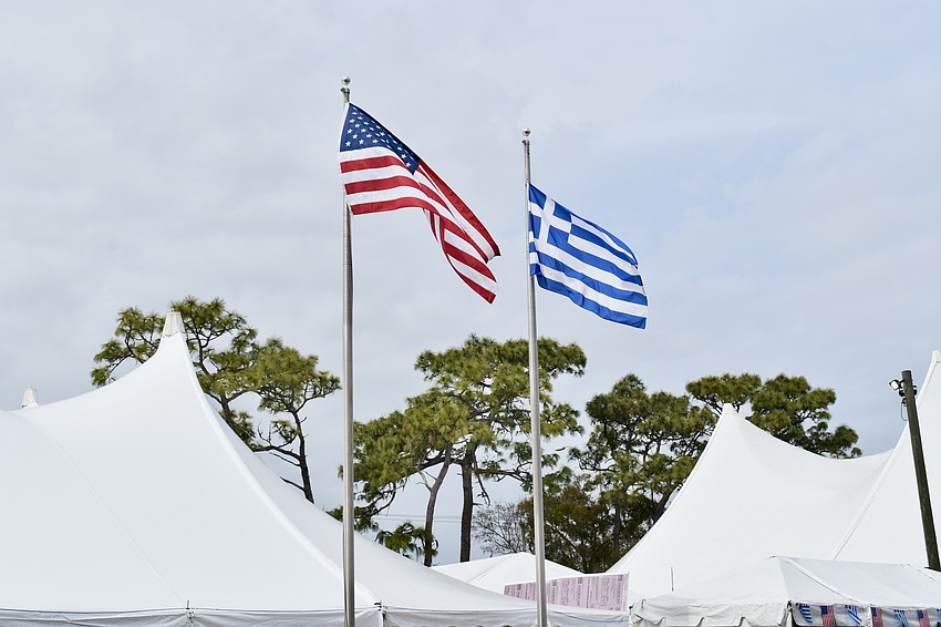 Both the American and Greek flags fly on Feb. 16 for the first day of the 40th annual St. Barbara Greek Festival.