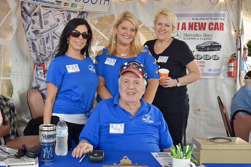 Mike Panagiotou (seated), Lynn Clement, Carol Pandis and Lori Amrien have 2,000 raffle tickets to sell. The prize is a new car or $35,000.