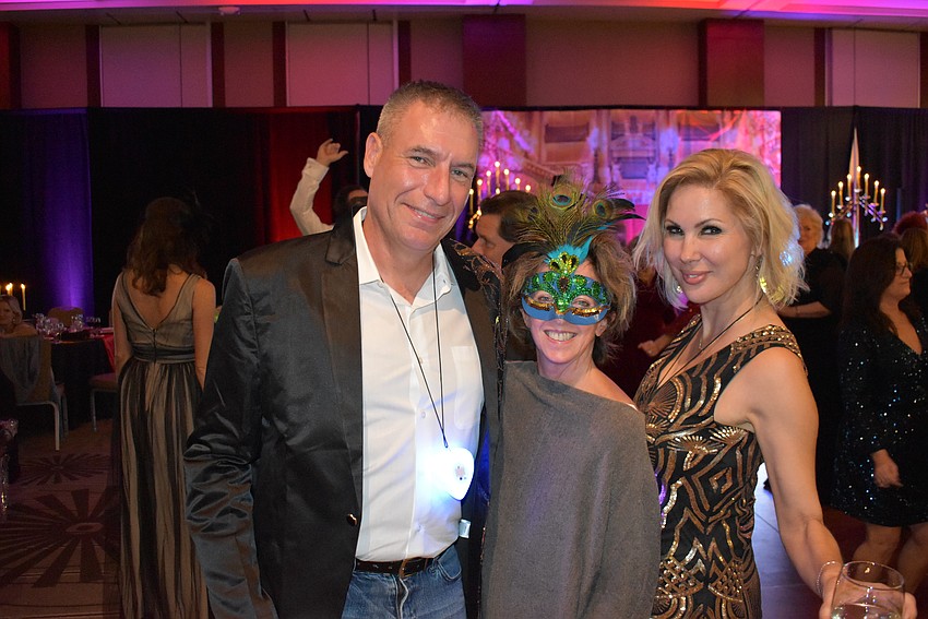 Rich Medford, Stephanie Peabody, and Karen Medford hit the dance floor during the Phantom fundraiser.