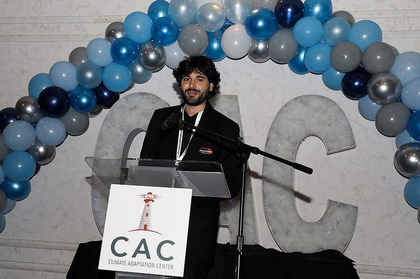 William Khabbaz, marketing assistant for sponsor Tommy's Express Car Wash, breaks down water usage per car washed at their locations