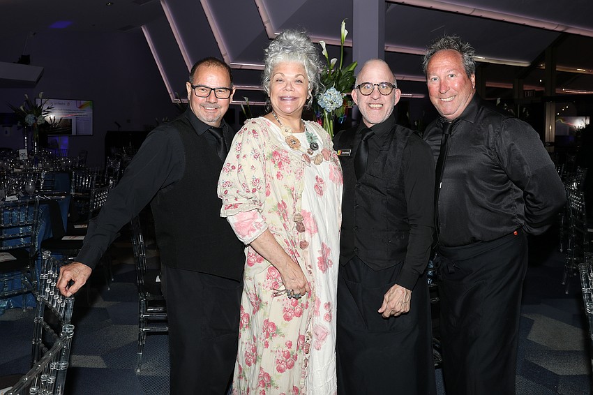 Michael's on East Catering Queen Tracey McCammack is photographed with crew members Douglas Noppe, Courtney Hershman and Andrew St. Martin