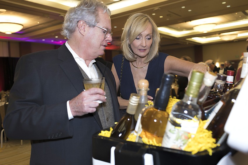 Bill and Lori Boyd peruse silent auction items