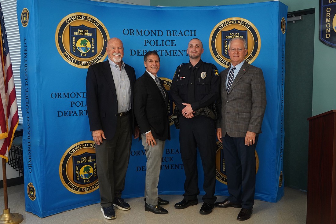 Ormond Beach Police Foundation board members Ed Kelly, Carl Persis, Officer of the Year Jeremy Cline, and Foundation board member Dwight Selby. Photo courtesy of Pauline Dulang