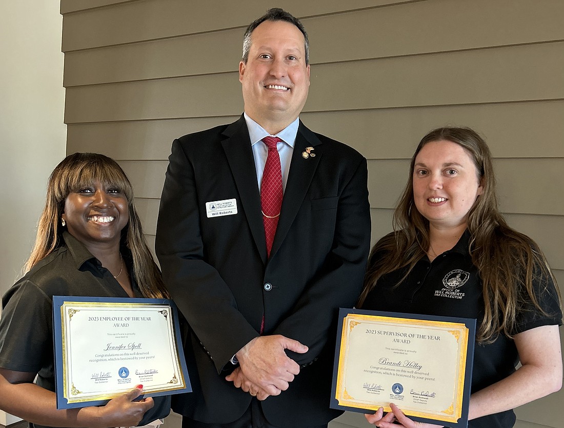 Employee of the Year Jennifer Spell, outreach specialist; Volusia County Tax Collector Will Roberts; and Supervisor of the Year Brandi Holley, a motorist services lead. Courtesy photo