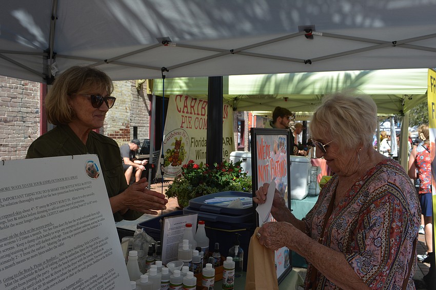 Lynn Lambris of Greenway Formula 7 helps a customer, Clara Smith of Bend, Oregon.