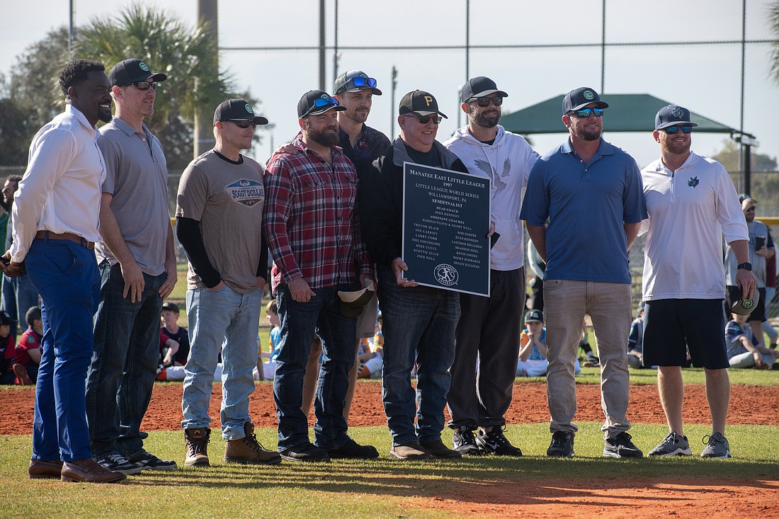 The 1997 Manatee East All-Stars receive a commemorative plaque, which will hang at Lakewood Ranch Little League's fields. The team reached the Little League World Series in Williamsport, getting eliminated in the semifinals.