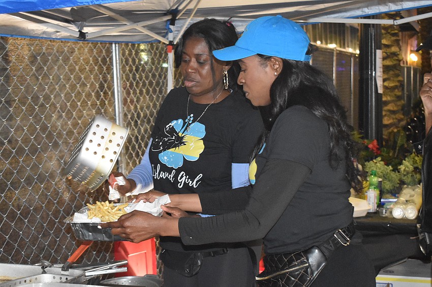 Diane Wilson and Star Gordon prepare food at Island Girl.