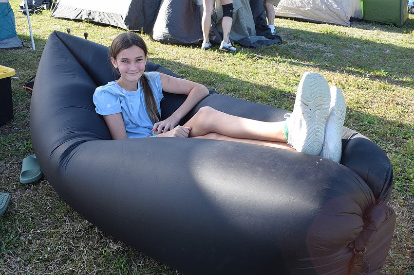 Greenbrook 11-year-old Olivia Blitz gets cozy on an inflatable couch.