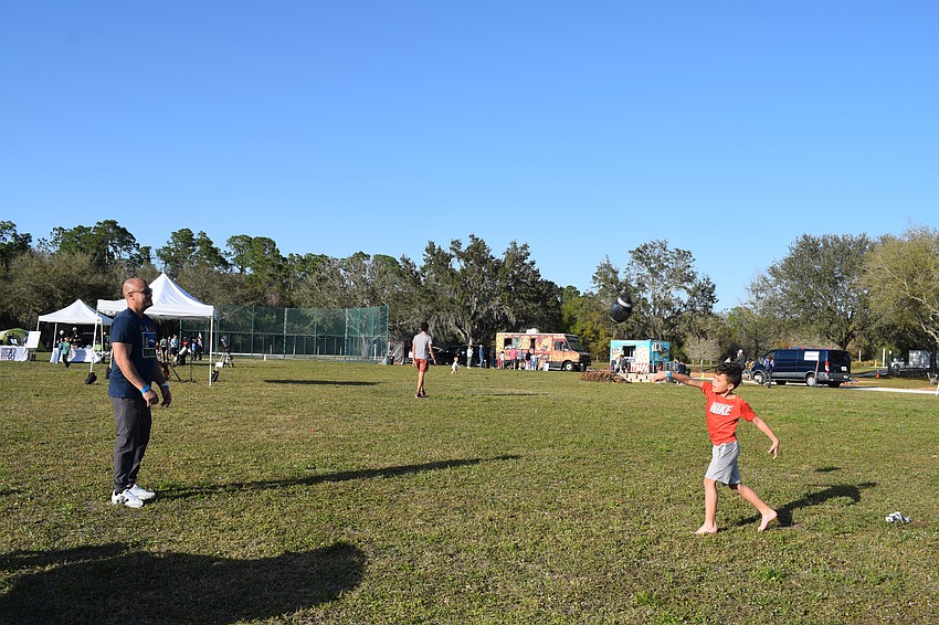 Parrish's Ismael Tanon looks forward to a night of father-son bonding with his 8-year-old son Cameron Tanon, starting with a game of catch.