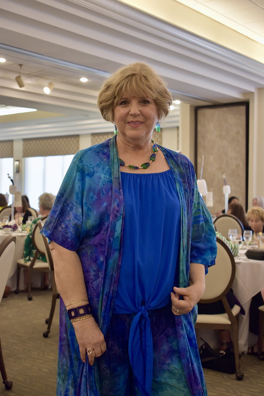 Debbie Frock is wearing a duster by Pineapple.