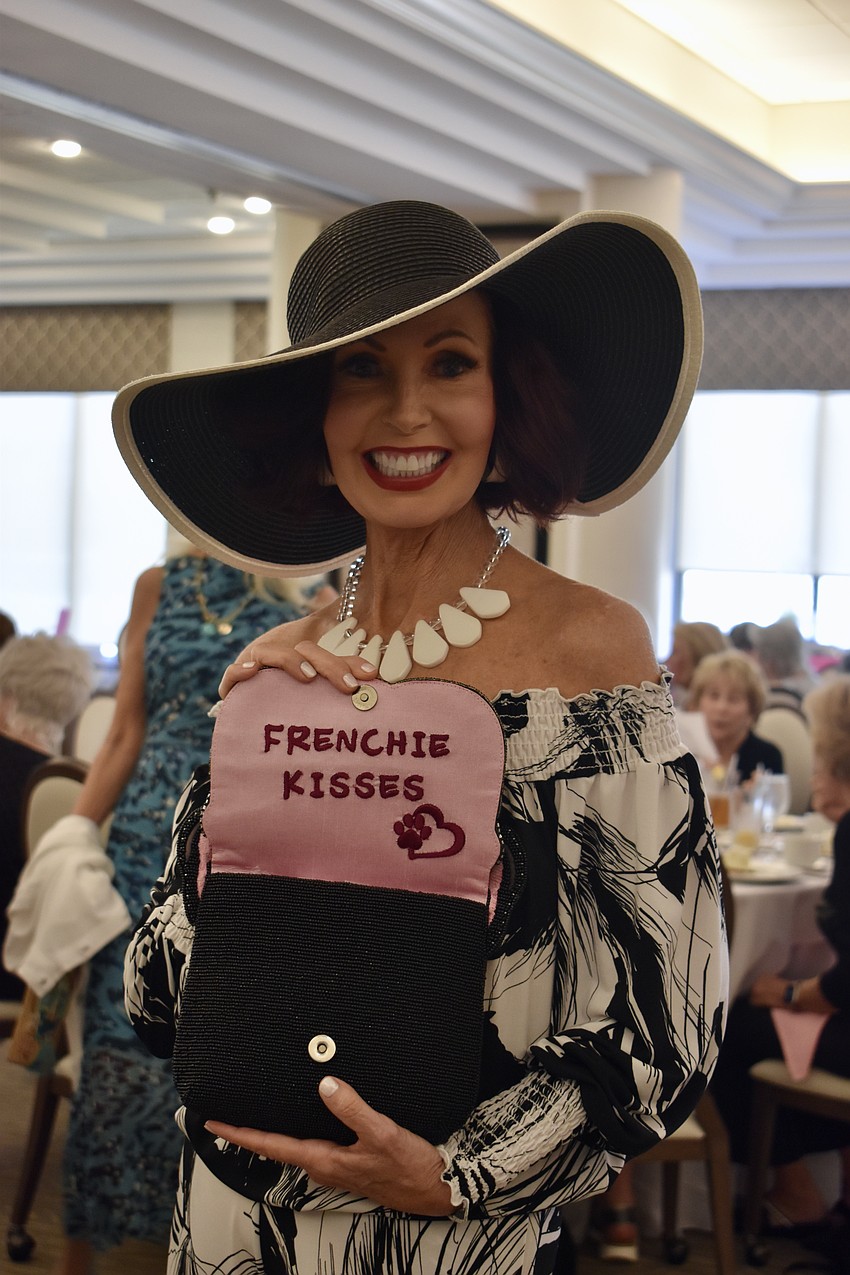 Katherine Pike opens up this black clutch to reveal its secret message.