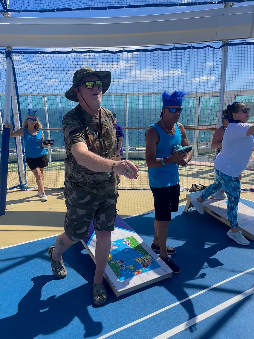 Bob Verhelst and Ken Harpley participate in a game of cornhole on the cruise.