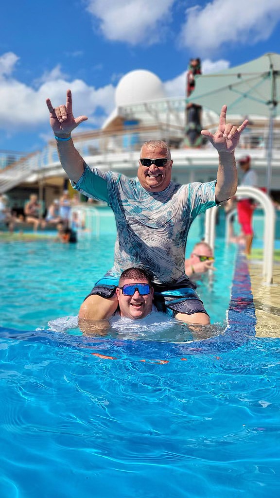 Daryl Haworth and Chris McComas splash around the pool.