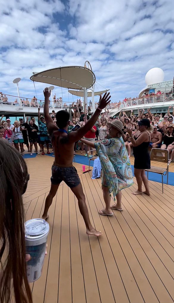 MVP Sports and Social members cheer as loud as possible as their own Cesar Sandoval is crowned Sexiest Man Alive on the cruise.