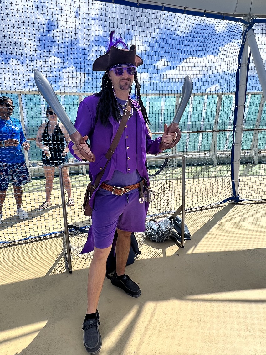 Tony Bartolus dresses in a purple pirate costume to show his team spirit.